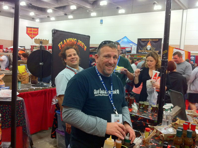 Tracy Carter of JAC\'s Tailgaters helps out at the Flaming Joe\'s booth.
