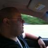 On the road with Buddah. He's daydreaming about foo foo drinks.