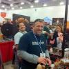 Tracy Carter of JAC's Tailgaters helps out at the Flaming Joe's booth.