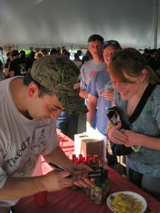 Benito Maniscalco signing bottles